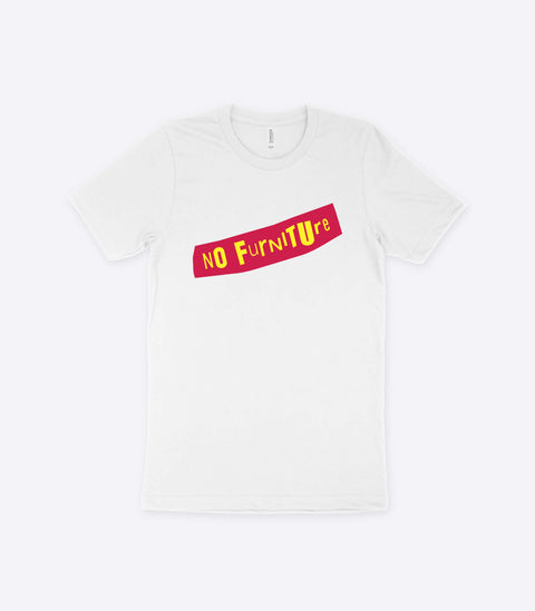 Punk guy with tattoos modelling a spoof Sex Pistols white t-shirt designed by Amok