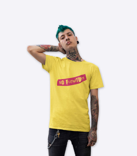 Punk guy with tattoos modelling a spoof Sex Pistols yellow t-shirt designed by Amok