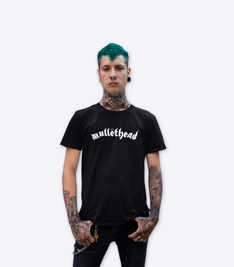Tattooed punk guy modelling a parody tshirt of the Motorhead logo designed by Amok