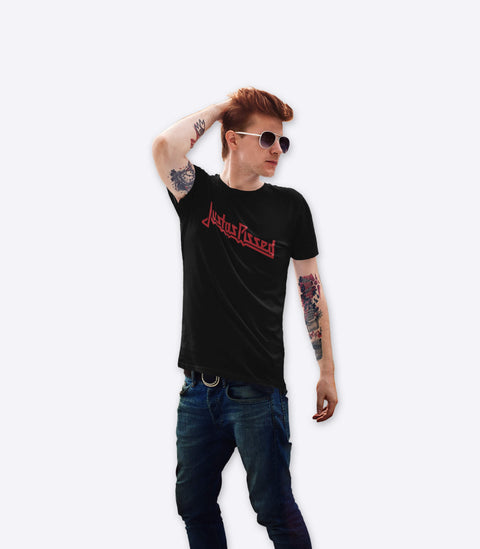 Tattooed rocker dude wearing a spoof of the classic Judas Priest tshirt deigned by Amok